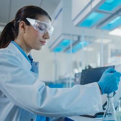 Modern Medical Research Laboratory: Female Scientist Working with Micro Pipette, Analysing Biochemicals Samples. Advanced Scientific Lab for Medicine, Microbiology Development.