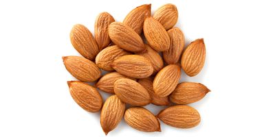 A small pile of almonds on a white background